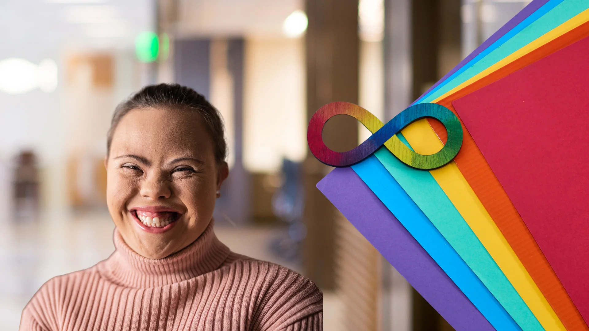 Women smilling with autism symbol on top